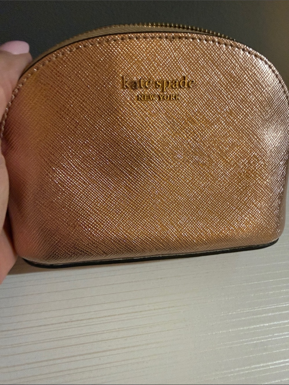Kate Spade New York Spencer Metallic Dome Cosmetic Case in Rose Gold.
